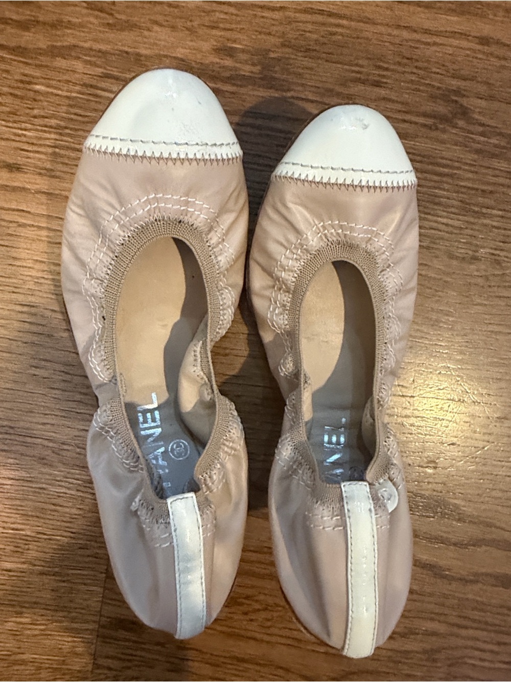 CHANEL Nude Ballet Flats with White Cap Toe